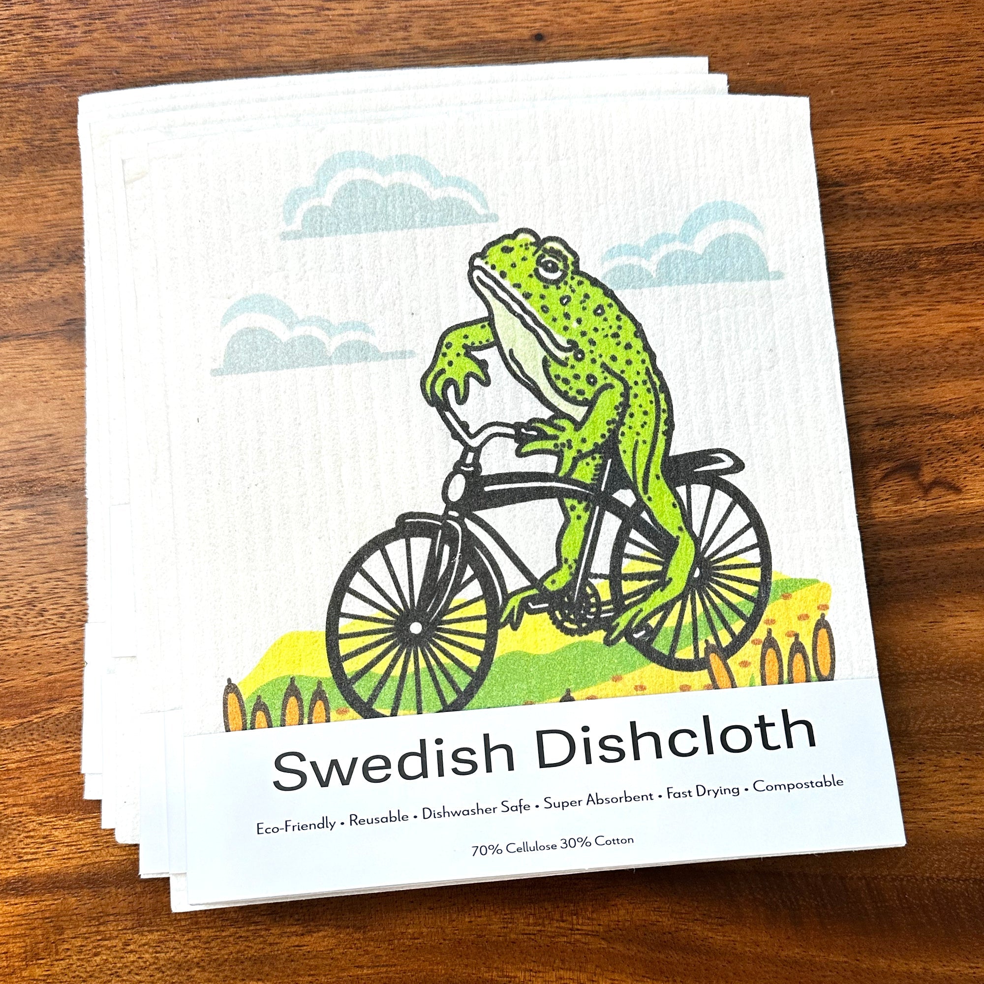 Stacked Frog On A Bike Swedish Dishcloths, these compostable kitchen cloths bring a lively touch to your cleaning routine.