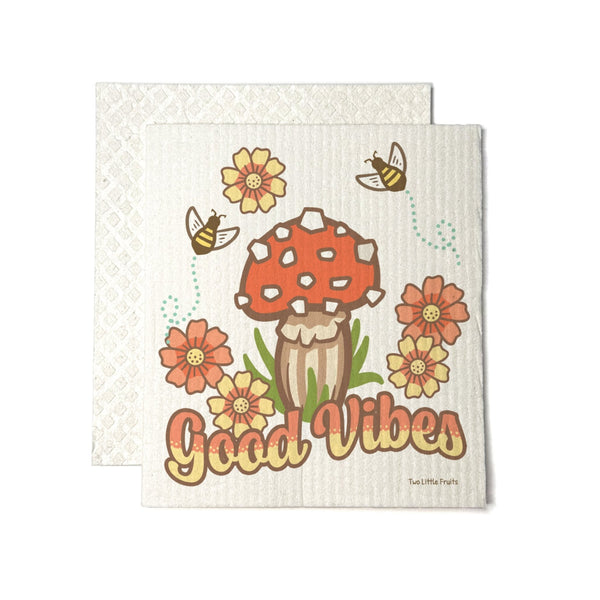 Cheerful mushroom dishcloth featuring a whimsical design with a red mushroom, colorful flowers, and bees, highlighting the cute 'Good Vibes' phrase.