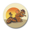 A vibrant image of the Colorado Hobo Squirrel Button Pin showcasing a cute squirrel with a bag on its stick, highlighting the soft-touch matte finish and the iconic Colorado scenery.