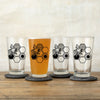 A collection of bee beer glasses displaying unique designs, perfect for serving drinks at gatherings.