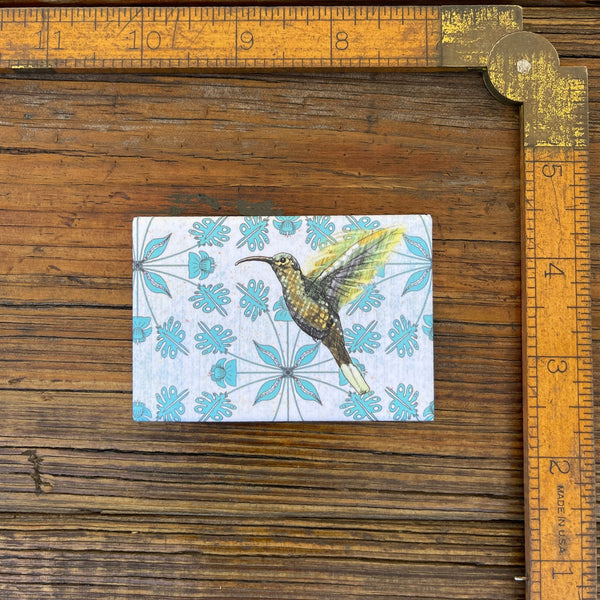 Close-up of the Hummingbird Fridge Magnet next to a ruler, emphasizing its size and intricate detail for a decorative touch.