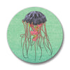 A vibrant jellyfish button pin with a captivating jellyfish illustration on a textured green background, perfect for ocean lovers.