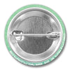 The back view of a jellyfish button pin, showing the metallic pin mechanism against a green textured background, highlighting its quality craftsmanship.