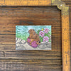 Quirky Knitting Marmot Magnet next to a ruler for size reference, featuring a friendly marmot and floral elements, perfect for decorating your fridge and organizing your reminders!