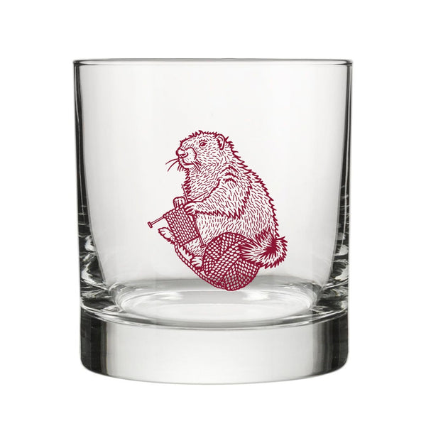 Knitting rocks glass elegantly displayed, highlighting its unique mauve background and durable construction.