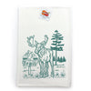 Moose Kitchen Towel displayed with a tag, featuring an adorable moose wearing boots in a scenic backdrop, a delightful addition to your collection of cotton kitchen towels.