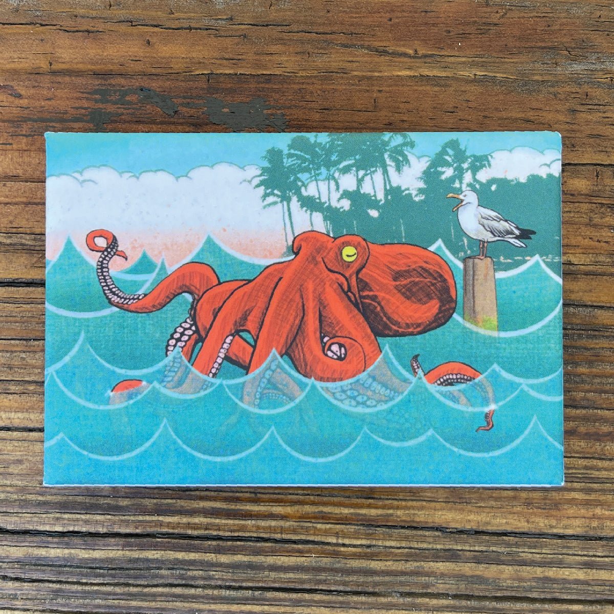 Bright and colorful octopus fridge magnet featuring a vibrant red octopus in the ocean, perfect for adding personality to your kitchen.