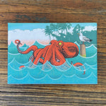 Bright and colorful octopus fridge magnet featuring a vibrant red octopus in the ocean, perfect for adding personality to your kitchen.