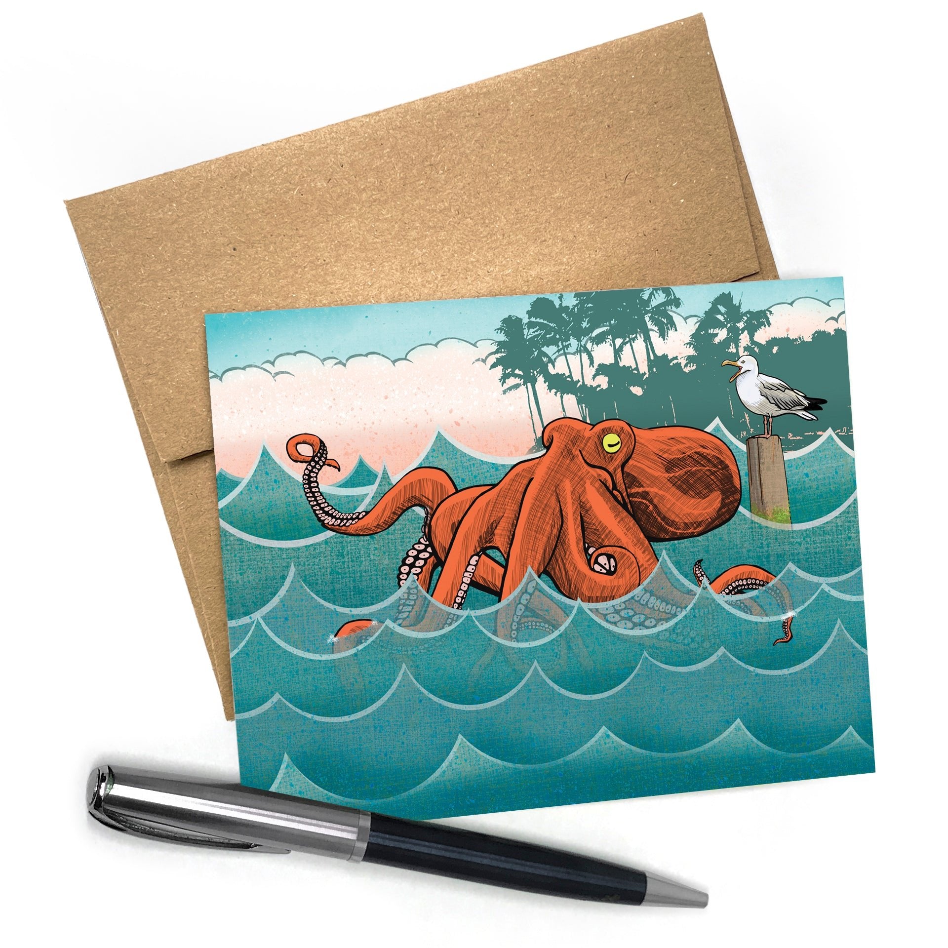 Bento the Octopus greeting card featuring a whimsical illustration of an octopus in vibrant colors, set against a backdrop of waves, palm trees, and a seagull, accompanied by a brown A2 envelope and a pen.