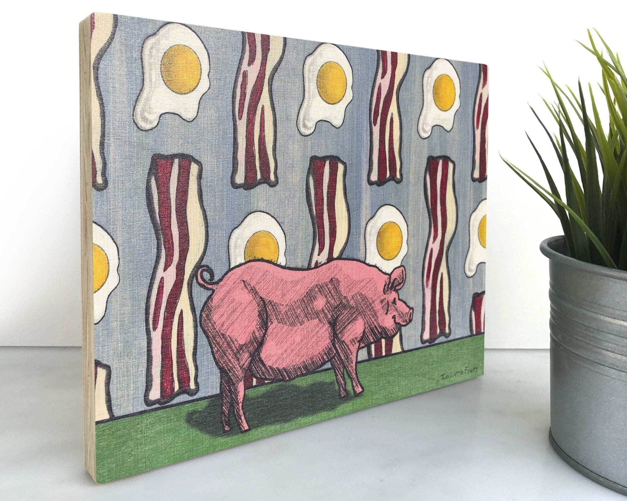 Pig and Bacon 8x10 Wood Art Block featuring a whimsical pink pig illustration amidst a colorful background of bacon and eggs, perfect for enhancing your farmhouse decor wall art.