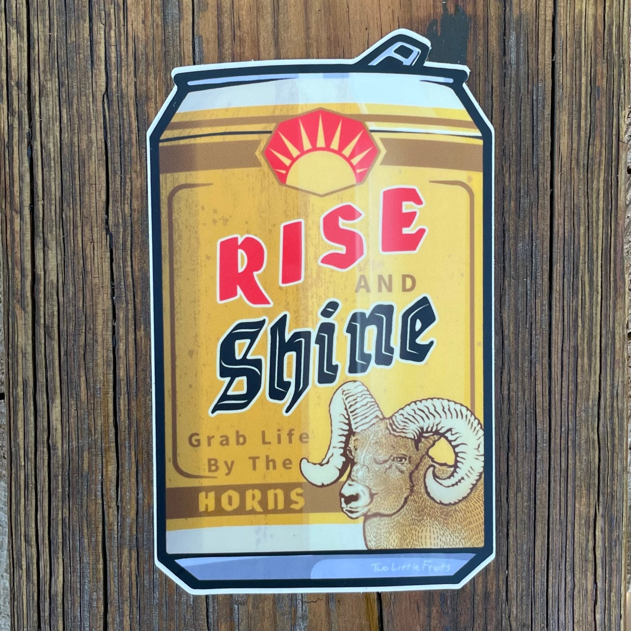 Vibrant beer can sticker illustration of a bighorn sheep, showcasing the phrase 'Rise and Shine' in a playful, bold style.