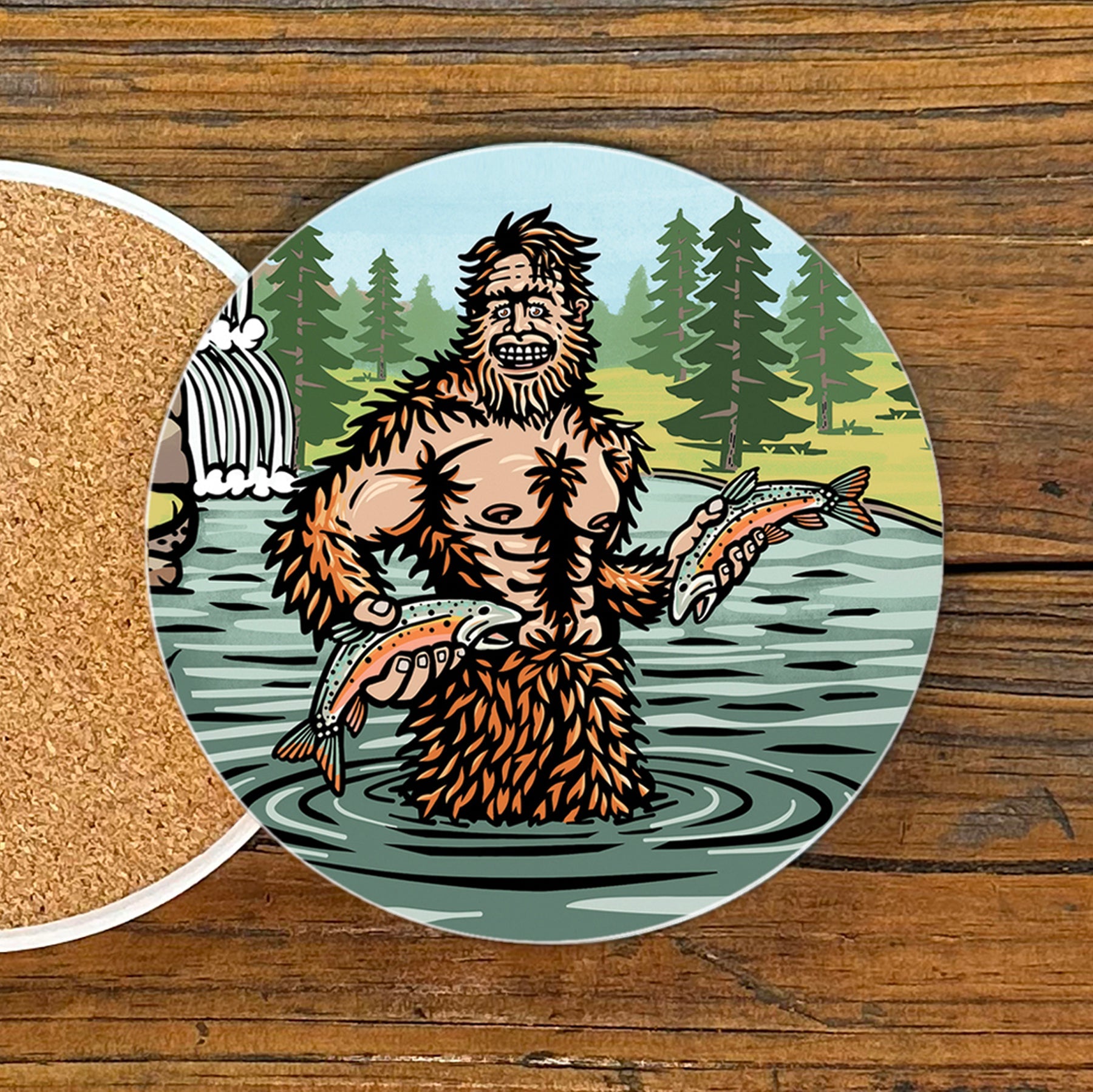 Bright Sasquatch Drink Coaster featuring a fun illustration of a cheerful Sasquatch holding fish, perfect for adding character to your coffee table. A great choice for unique coffee table coasters.