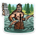 Sasquatch Sticker design depicting a cheerful Sasquatch holding fish in a river, with a lush forest in the background, created by Two Little Fruits.