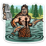 Sasquatch Sticker design depicting a cheerful Sasquatch holding fish in a river, with a lush forest in the background, created by Two Little Fruits.