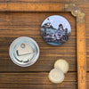 Magnificent Skipper Sea Lion magnetic bottle opener on a wooden surface, showcasing its artistic design. The cooler features soft-touch matte finish. Perfect for parties and gatherings as a stylish accessory among cool bottle openers.