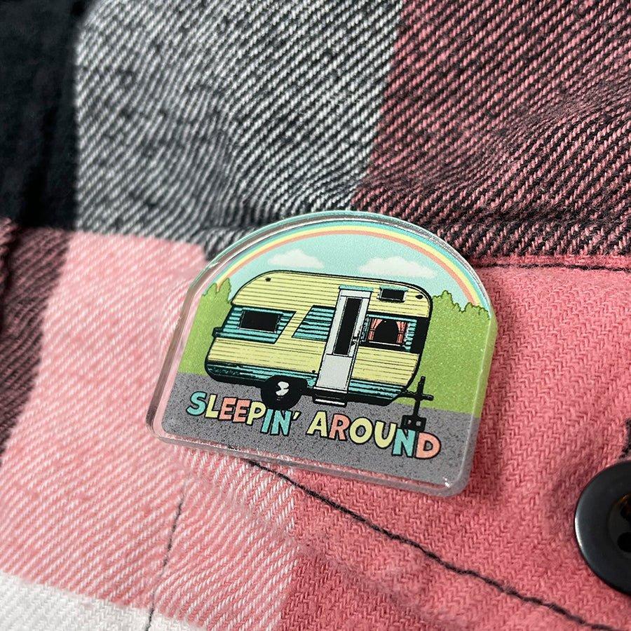 Sleepin Around Camp Trailer Acrylic Pin showcased on clothing, adding a delightful touch for unique camping apparel lovers.