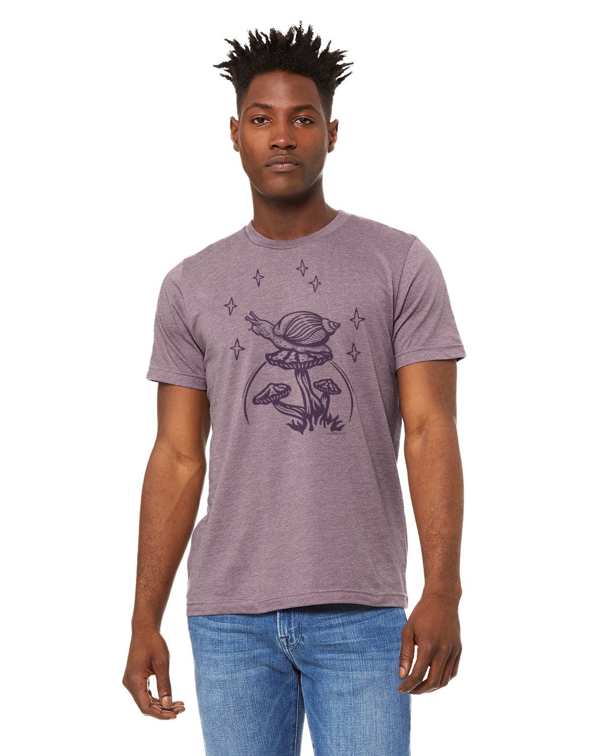 A cheerful model wearing a Snail and Mushroom Purple Cotton Tee Shirt featuring a whimsical snail graphic. Perfect for casual wear, this snail graphic tee is designed for both men and women.