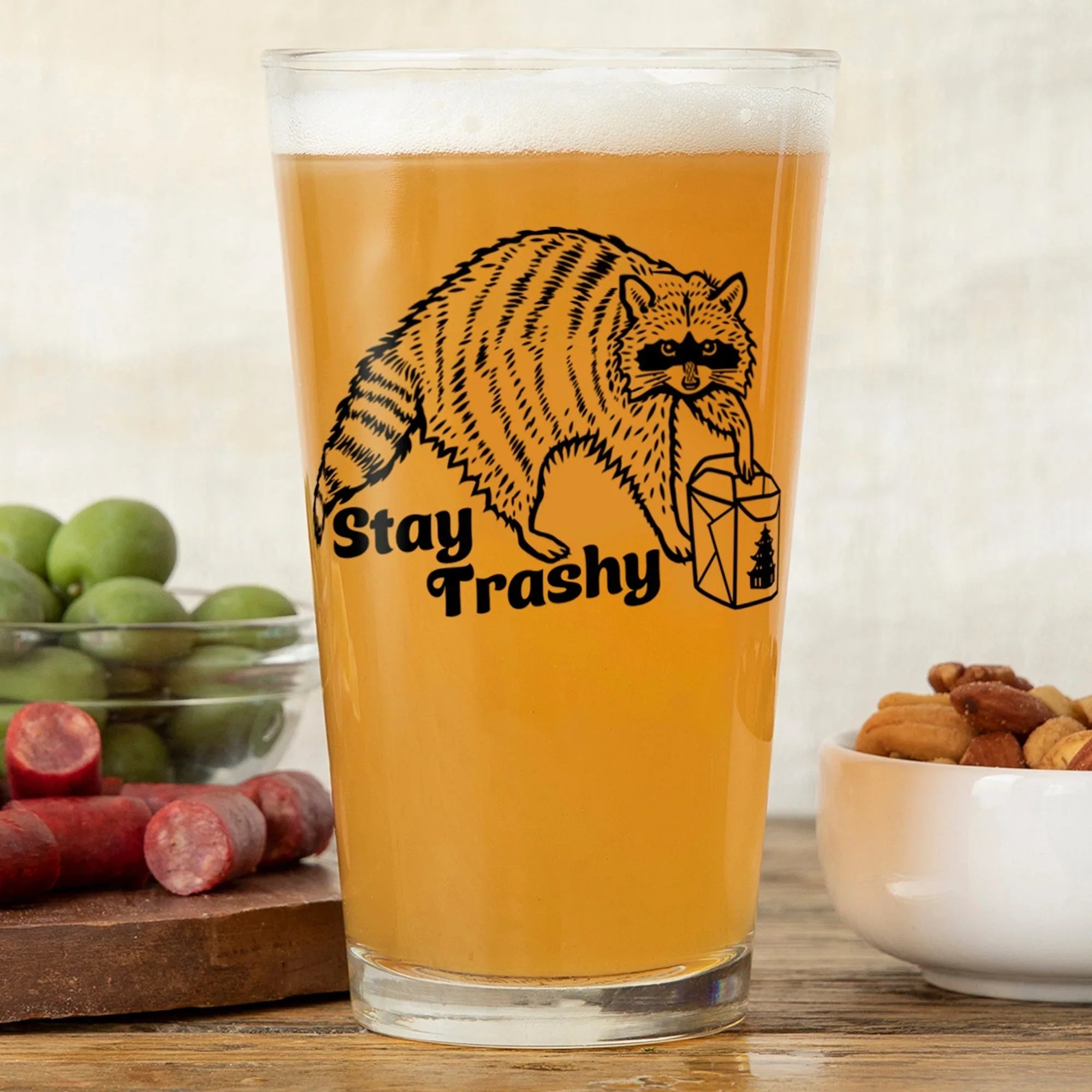 Stay Trashy Raccoon illustrated pint glass by Two Little Fruits
