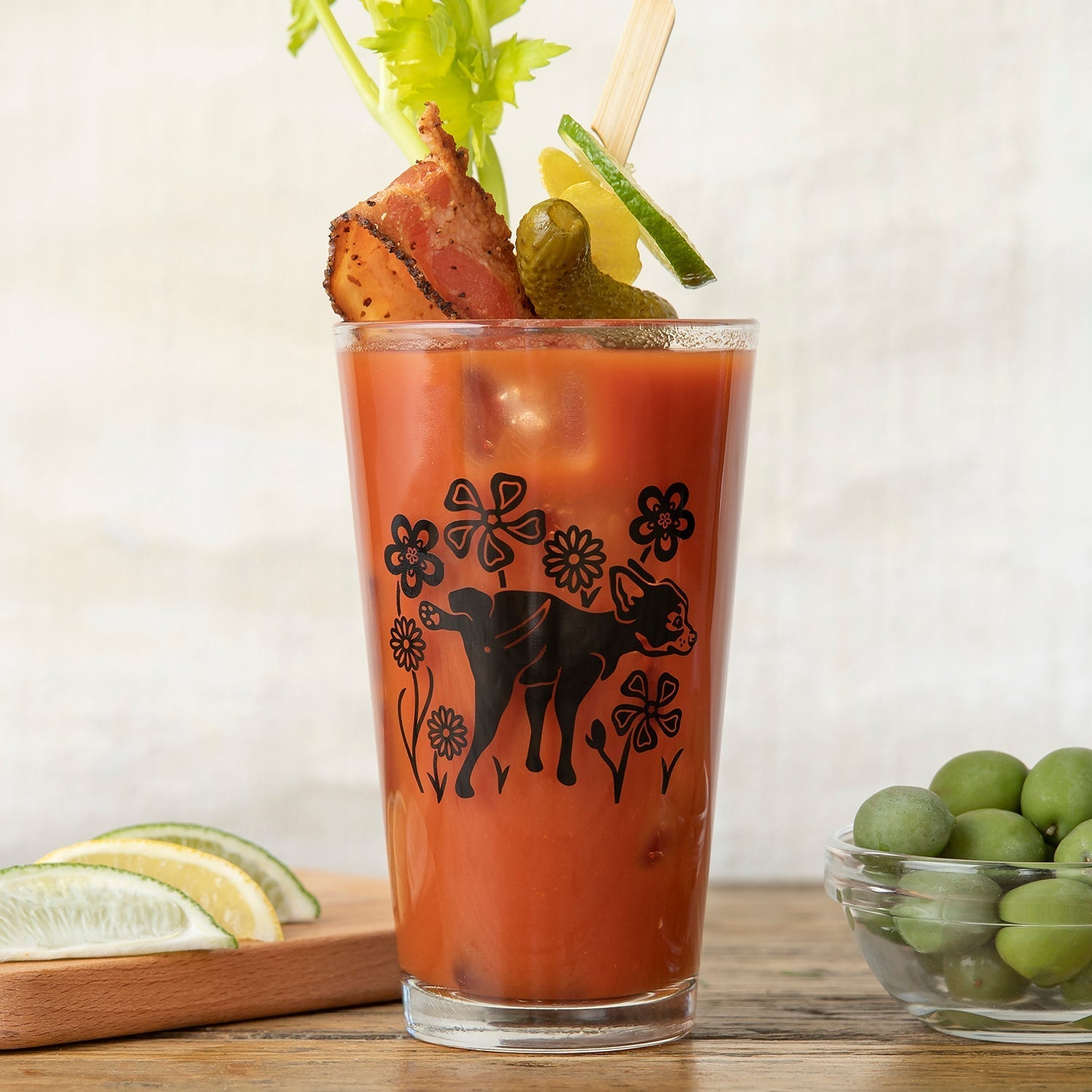 Unique Beer Glass Set depicting a playful pig amidst floral designs, perfect for craft beer lovers enjoying spicy cocktails.